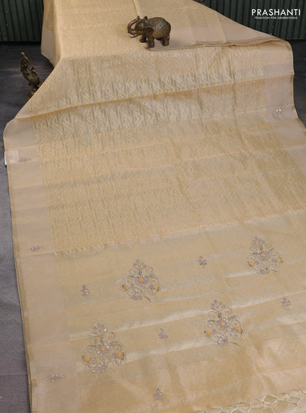 Kota tissue saree sandal with allover zari weaves and embroidered butta boder