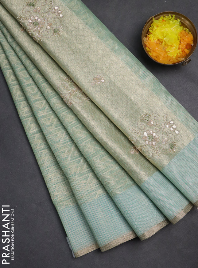 Kota tissue saree teal blue with allover zari weaves and embroidered butta boder