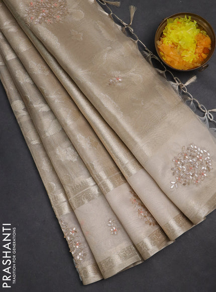 Kota tissue saree beige with zari woven buttas and embroidered butta boder
