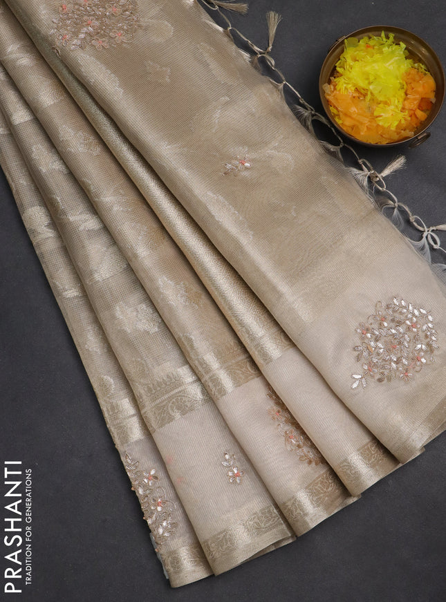 Kota tissue saree beige with zari woven buttas and embroidered butta boder