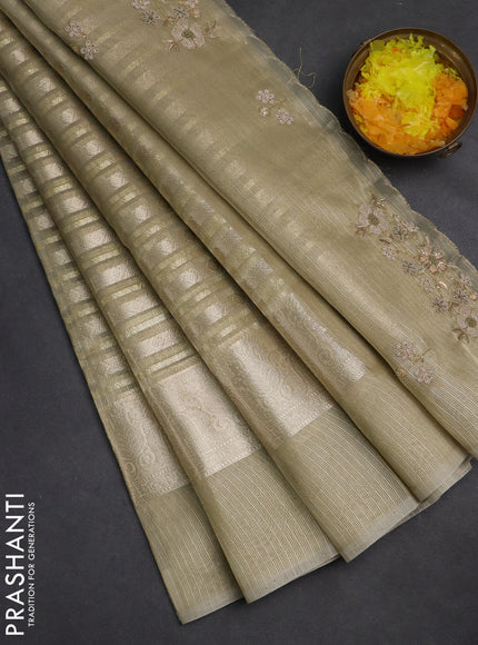 Kota tissue saree mild pista with allover zari weaves and zari woven embroidered butta boder
