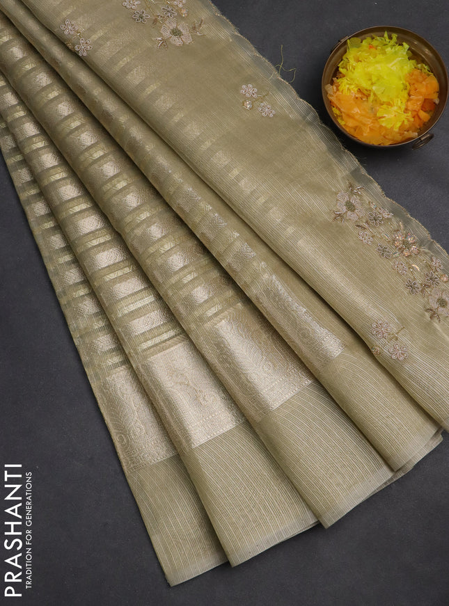 Kota tissue saree mild pista with allover zari weaves and zari woven embroidered butta boder