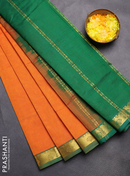 Silk cotton saree orange and green with plain body and zari woven border