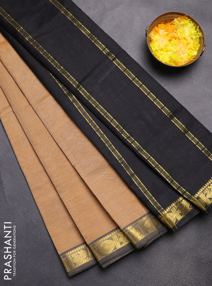 Silk cotton saree sandal and black with plain body and zari woven border