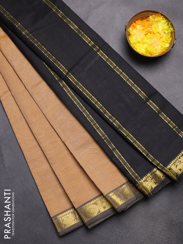 Silk cotton saree sandal and black with plain body and zari woven border