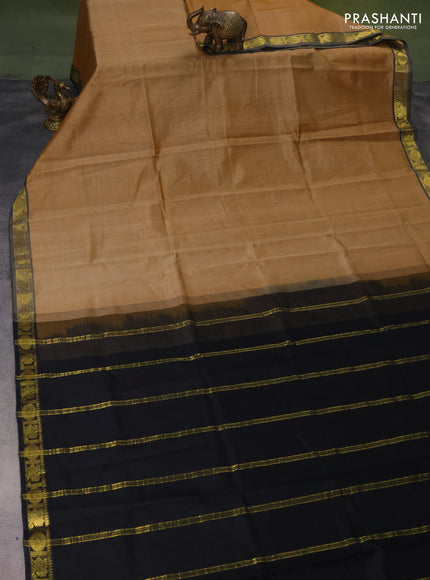 Silk cotton saree sandal and black with plain body and zari woven border