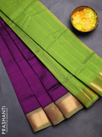 Silk cotton saree deep purple and light green with plain body and zari woven border