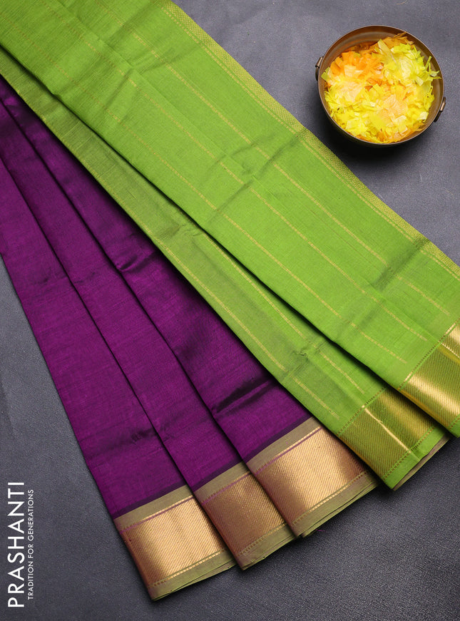 Silk cotton saree deep purple and light green with plain body and zari woven border