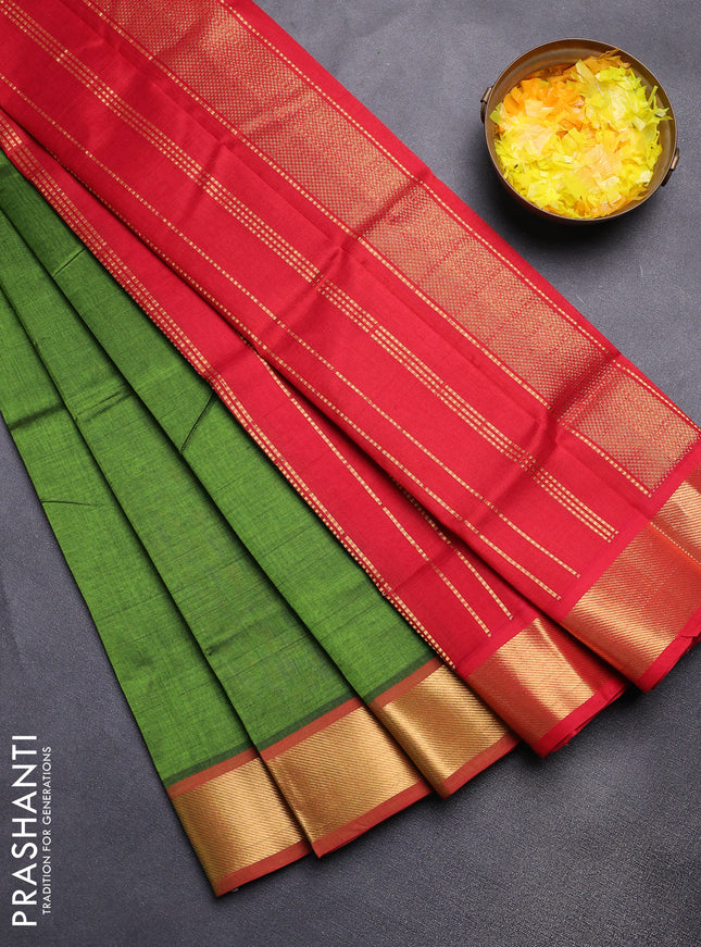 Silk cotton saree green and maroon with plain body and zari woven border