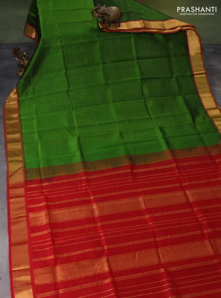 Silk cotton saree green and maroon with plain body and zari woven border