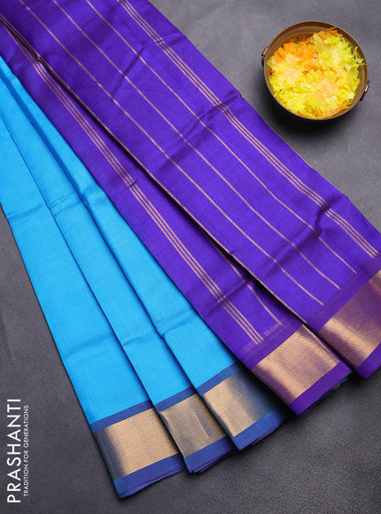 Silk cotton saree light blue and blue with plain body and zari woven border