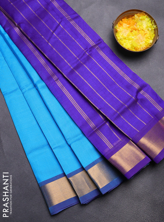 Silk cotton saree light blue and blue with plain body and zari woven border