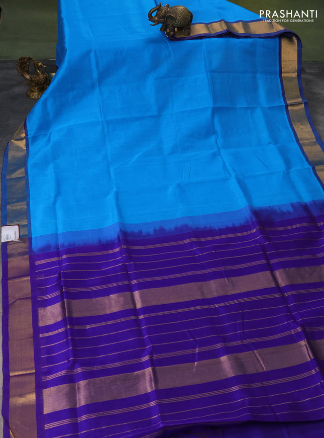 Silk cotton saree light blue and blue with plain body and zari woven border
