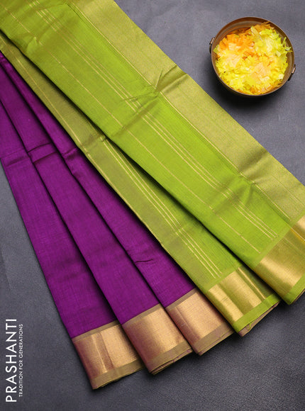 Silk cotton saree purple and light green with plain body and zari woven border
