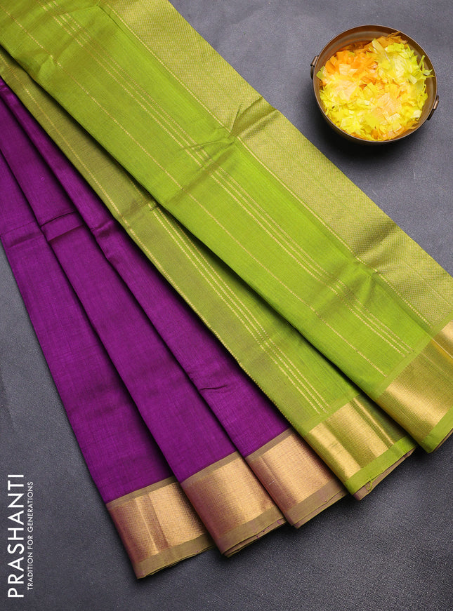 Silk cotton saree purple and light green with plain body and zari woven border
