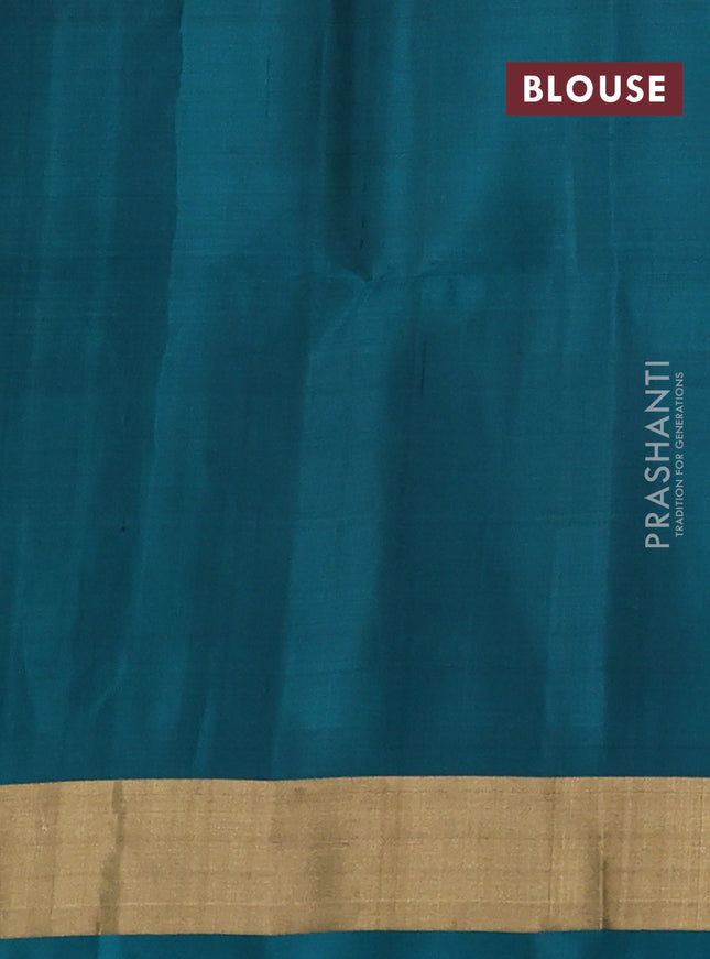 Ikat soft silk saree dual shade of pinkish orange and peacock green with allover ikat weaves and long ikat woven zari woven border