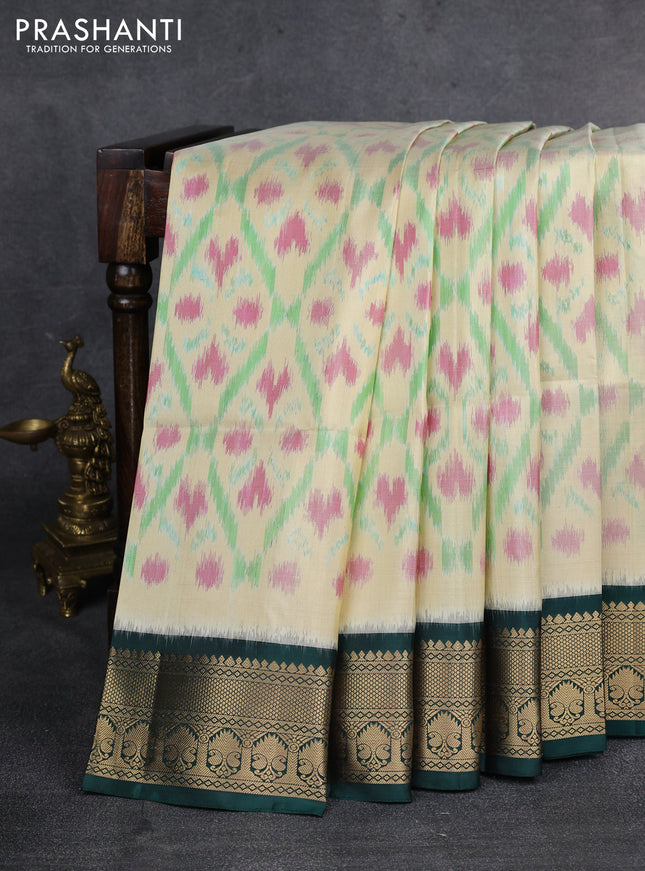 Ikat soft silk saree cream and dark green with allover ikat weaves and zari woven border