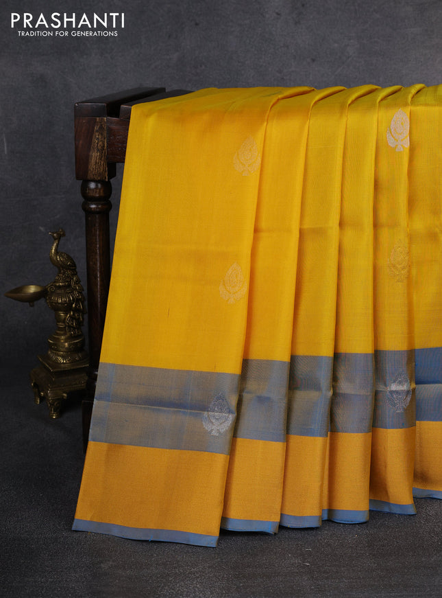 Pure uppada silk saree yellow and cs blue with silver & gold zari woven buttas and zari woven border