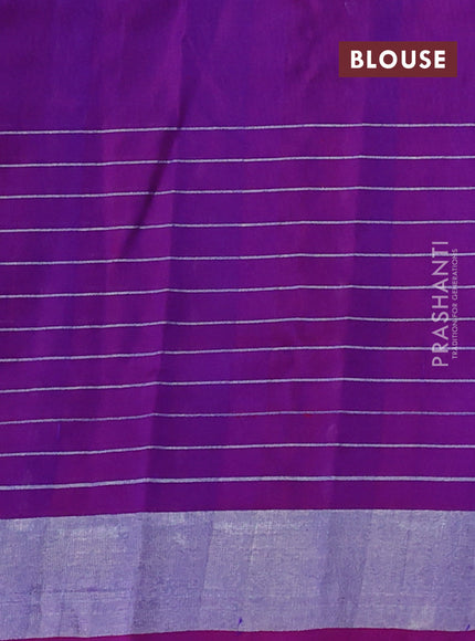 Pure uppada silk saree dual shade of bluish green and purple with allover silver zari woven butta weaves and silver zari woven border