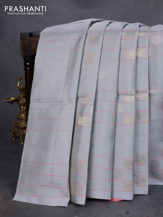 Pure soft silk saree pastel grey and peach shade with allover checks & zari buttas in borderless style