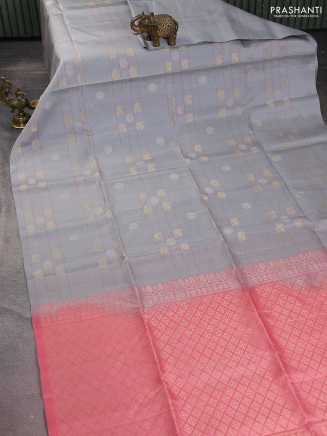 Pure soft silk saree pastel grey and peach shade with allover checks & zari buttas in borderless style