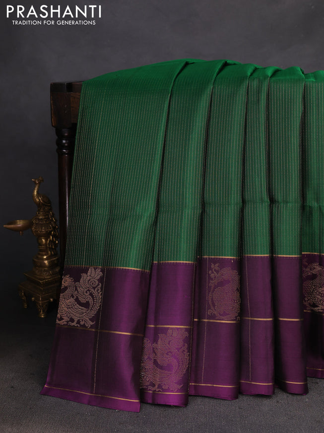 Pure soft silk saree green and deep purple with allover zari weaves and long zari checks butta border
