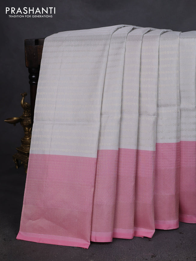 Pure soft silk saree off white and light pink with allover zari woevn brocade weaves and long zari woven border