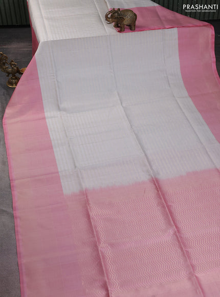 Pure soft silk saree off white and light pink with allover zari woevn brocade weaves and long zari woven border