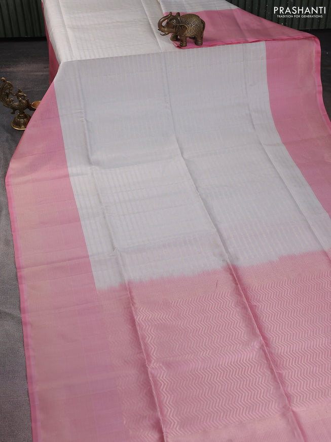 Pure soft silk saree off white and light pink with allover zari woevn brocade weaves and long zari woven border