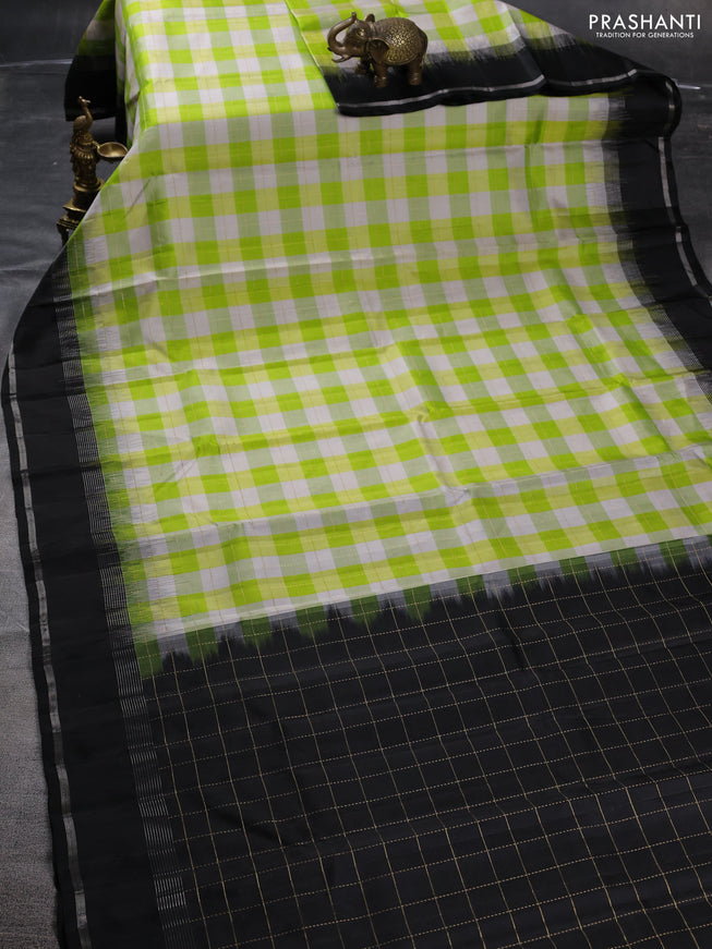 Pure soft silk saree light green off white and black with allover zari checked pattern and rettapet zari woven border