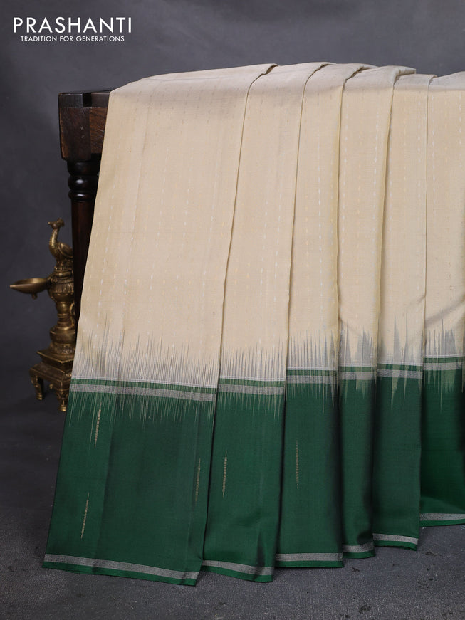Pure soft silk saree cream and green with allover silver & gold zari woven butta weaves and long zari woven butta border