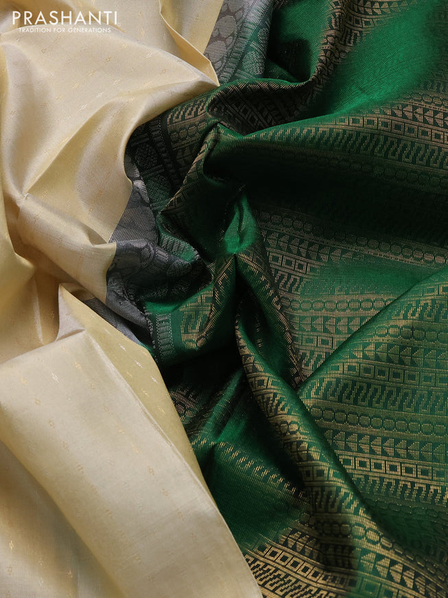 Pure soft silk saree cream and green with allover silver & gold zari woven butta weaves and long zari woven butta border