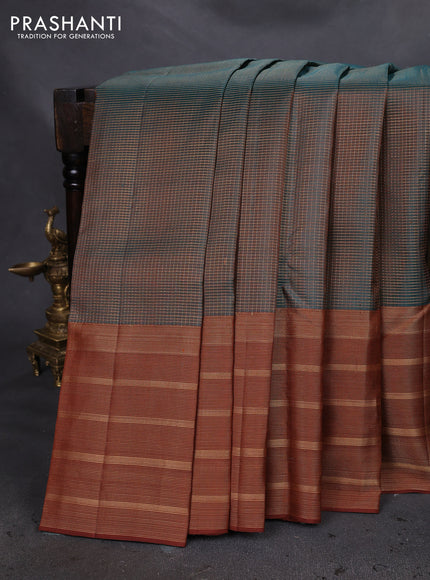 Pure soft silk saree dual shade of teal green and brown with allover small zari checked pattern and long zari woven border
