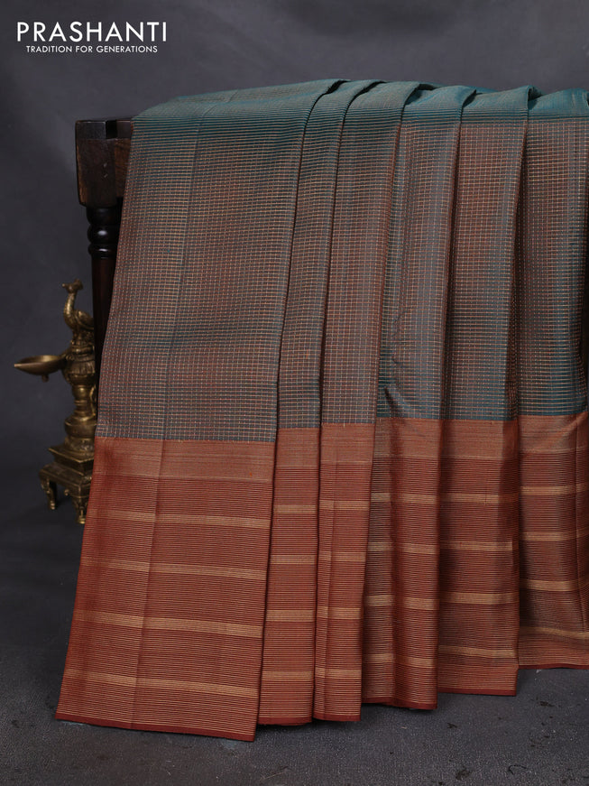 Pure soft silk saree dual shade of teal green and brown with allover small zari checked pattern and long zari woven border