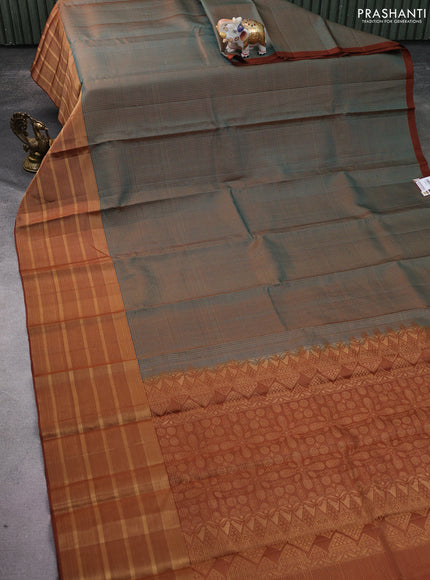 Pure soft silk saree dual shade of teal green and brown with allover small zari checked pattern and long zari woven border