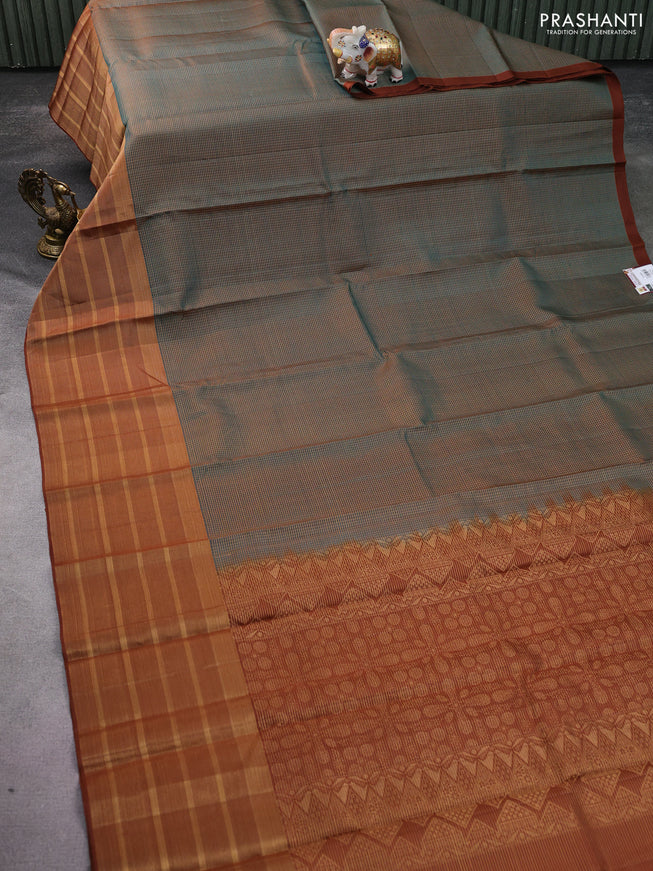 Pure soft silk saree dual shade of teal green and brown with allover small zari checked pattern and long zari woven border