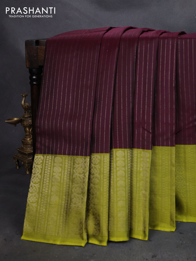 Pure soft silk saree wine shade and light green with allover zari woven strip pattern and long silver zari woven border