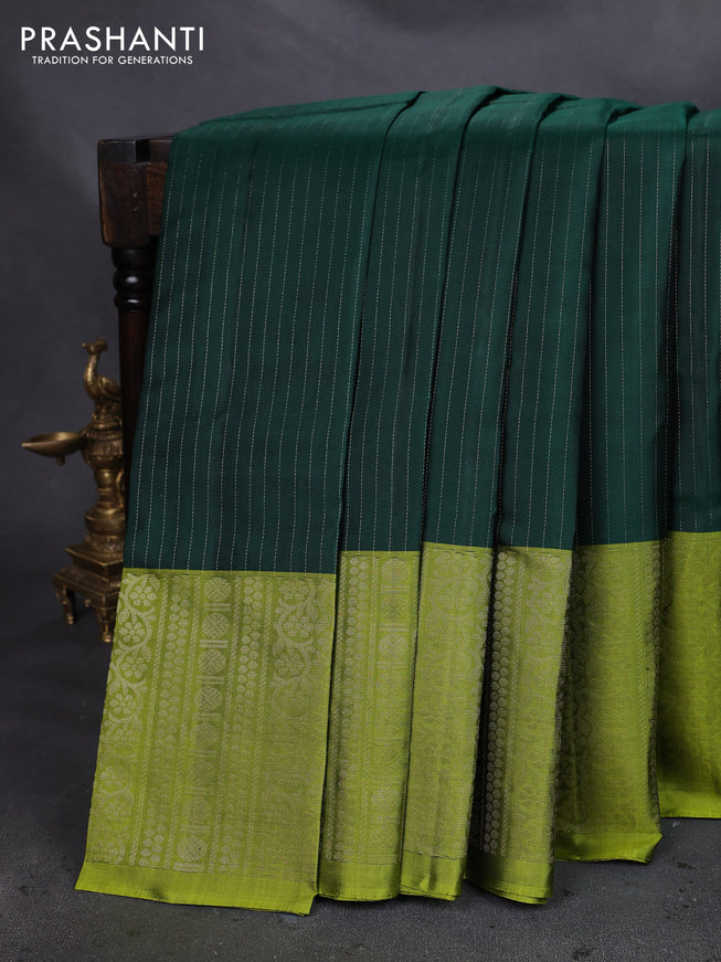 Pure soft silk saree bottle green and light green with allover zari woven strip pattern and long silver zari woven border