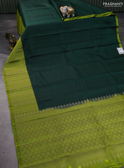 Pure soft silk saree bottle green and light green with allover zari woven strip pattern and long silver zari woven border