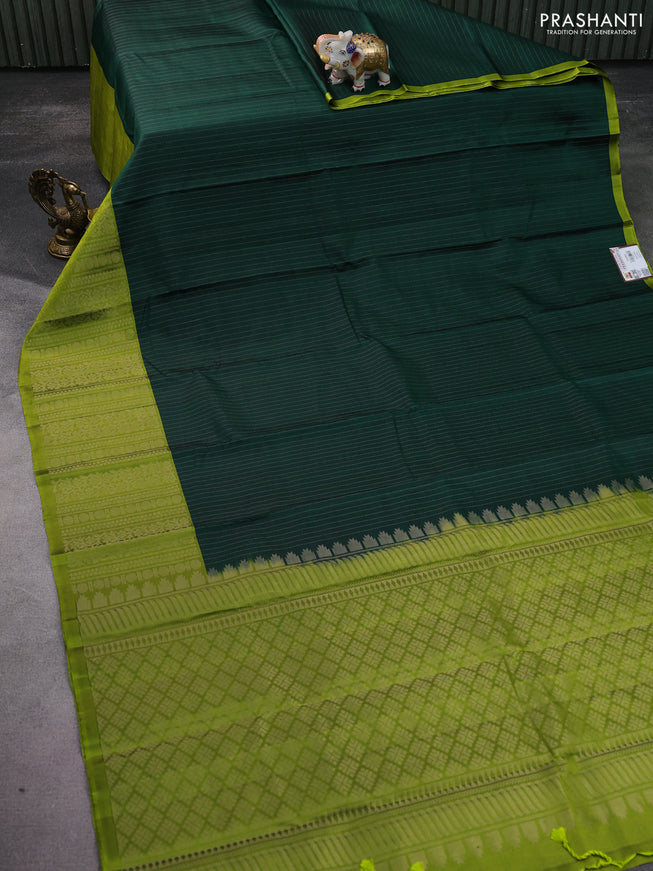 Pure soft silk saree bottle green and light green with allover zari woven strip pattern and long silver zari woven border