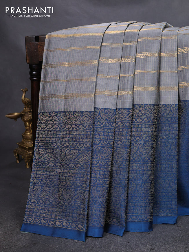 Pure soft silk saree grey and peacock blue with allover zari strip pattern and long zari woven border