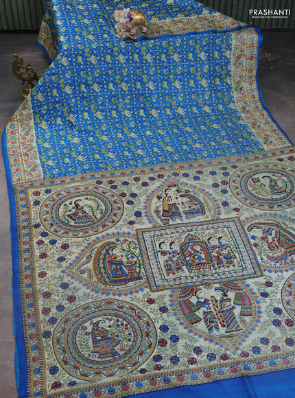 Printed silk saree blue and cream with allover patola prints and madhubani printed pallu & border