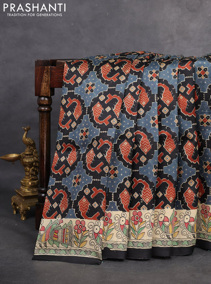 Printed silk saree black and cream with allover patola prints and madhubani printed pallu & border