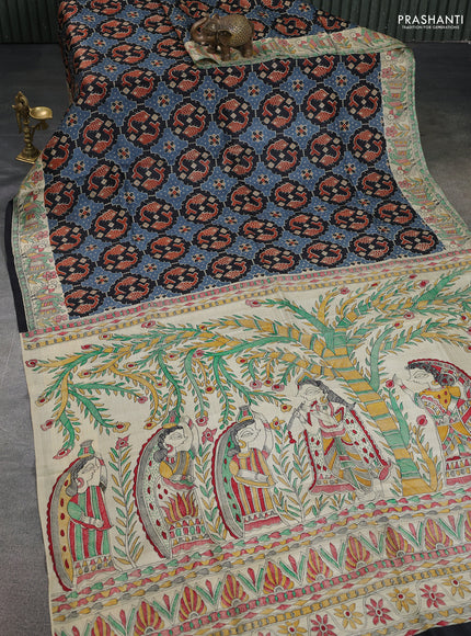 Printed silk saree black and cream with allover patola prints and madhubani printed pallu & border