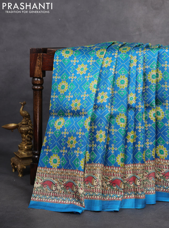 Printed silk saree cs blue and cream with allover ikat prints and madhubani printed pallu & border