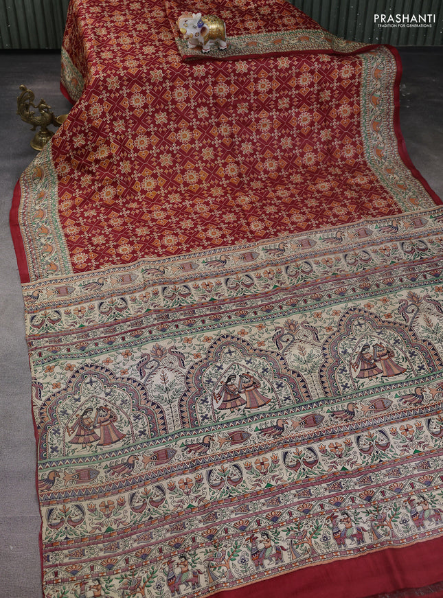 Printed silk saree maroon and cream with allover ikat prints and madhubani printed pallu & border
