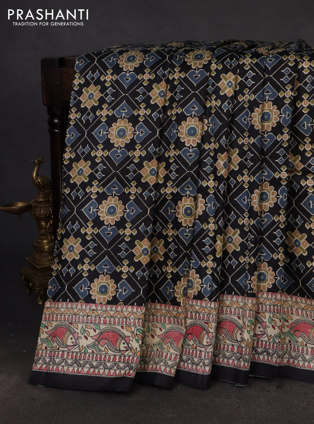 Printed silk saree black and cream with allover ikat prints and madhubani printed pallu & border