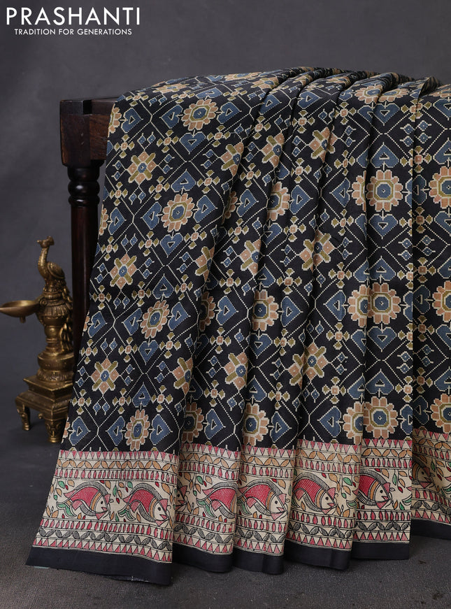 Printed silk saree black and cream with allover ikat prints and madhubani printed pallu & border