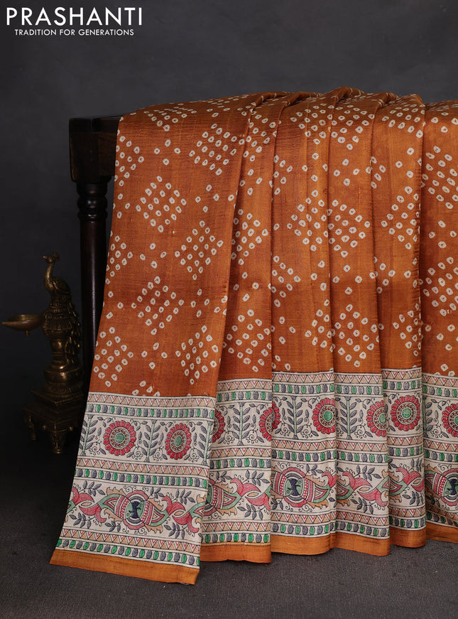 Printed silk saree dark mustard and cream with allover bandhani prints and madhubani printed pallu & border