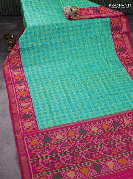 Rajkot patola silk saree dual shade of teal blue and pink with allover ikat weaves and ikat woven zari border